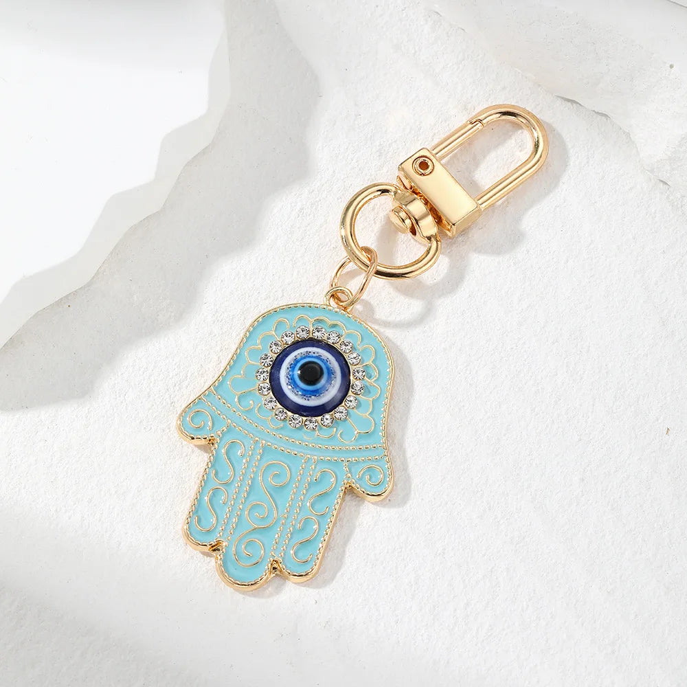 Bling Hollow Evil Eye Hamsa Hand Keychain Key Ring For Women Men Zircon Fatima Hand Blue Eye Bag Car Airpods Box Key Accessories